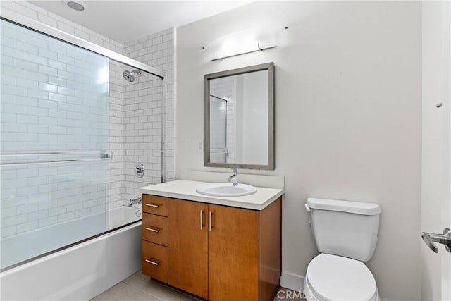 full bathroom with vanity, tile patterned flooring, enclosed tub / shower combo, and toilet