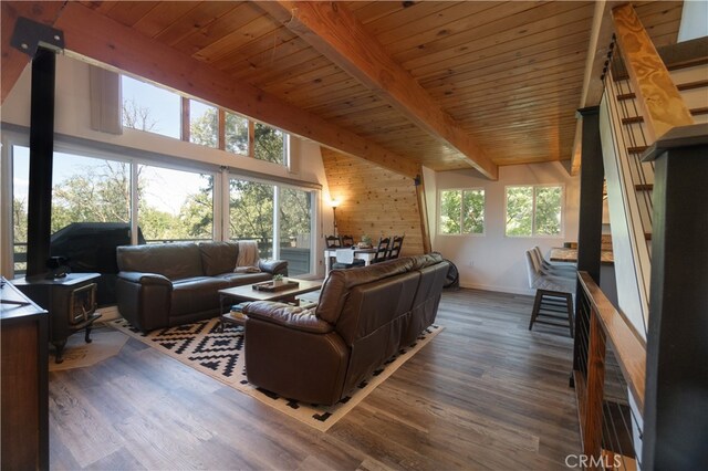 1154 Yukon Dr, Lake Arrowhead, CA 92352 - living room featuring wooden ceiling with exposed beams, wood finished floors, wooden walls, and baseboards