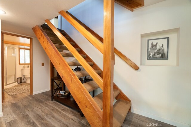 1154 Yukon Dr, Lake Arrowhead, CA 92352 - stairway featuring wood finished floors and baseboards