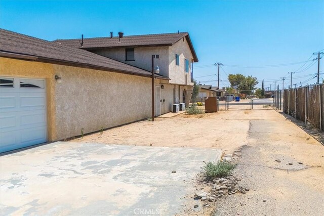 view of property exterior featuring a garage