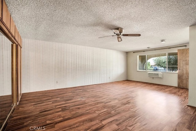 unfurnished living room featuring ceiling fan, a textured ceiling, and hardwood / wood-style flooring