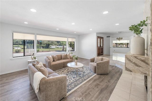 living room with hardwood / wood-style floors and a wealth of natural light