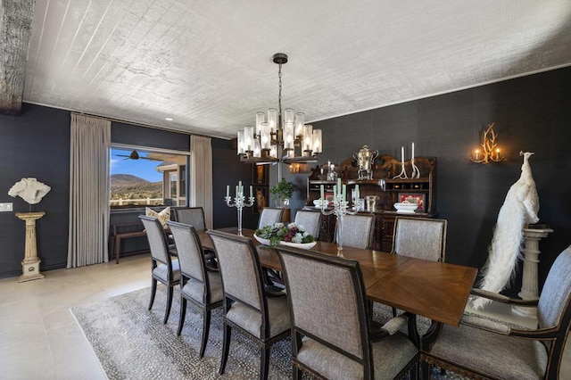 tiled dining area featuring a chandelier