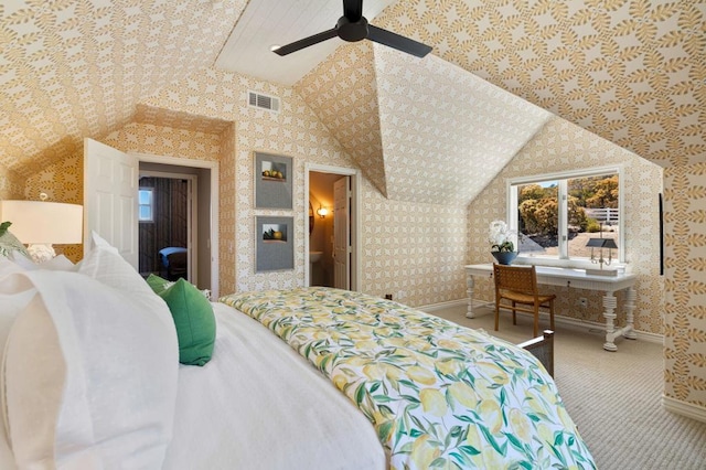 carpeted bedroom with vaulted ceiling and ceiling fan