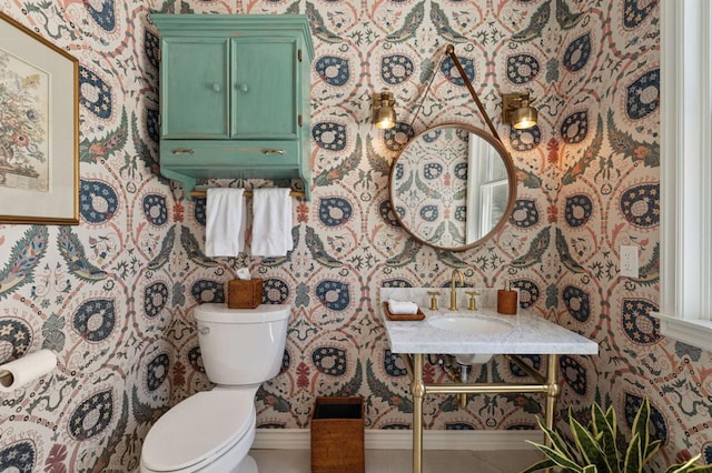 bathroom featuring sink and toilet