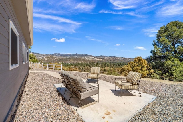 view of patio / terrace featuring outdoor lounge area and a mountain view