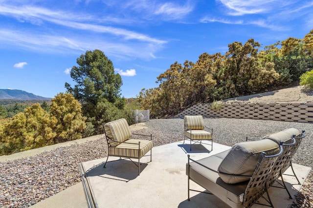 view of patio / terrace with a mountain view