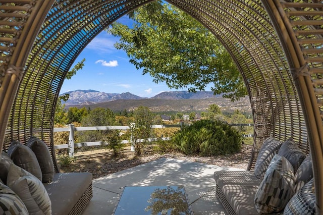 view of patio featuring a mountain view and a pergola