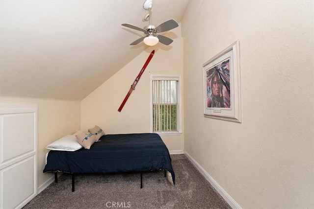 bedroom with vaulted ceiling, ceiling fan, and carpet flooring