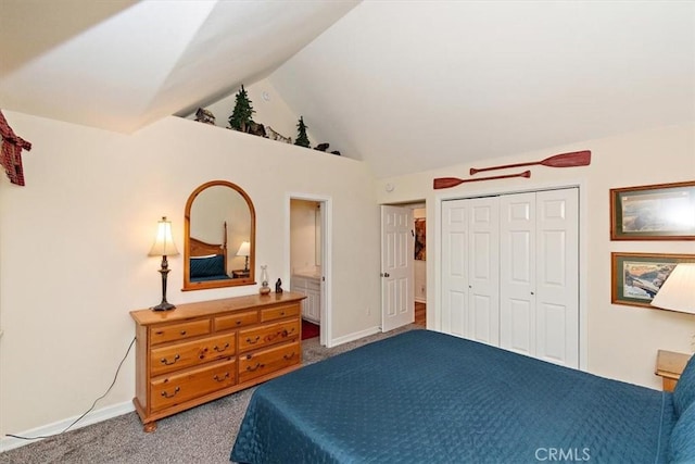 carpeted bedroom featuring vaulted ceiling and a closet