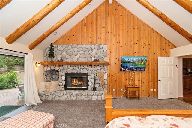 bedroom with beamed ceiling, access to exterior, a fireplace, and wood walls