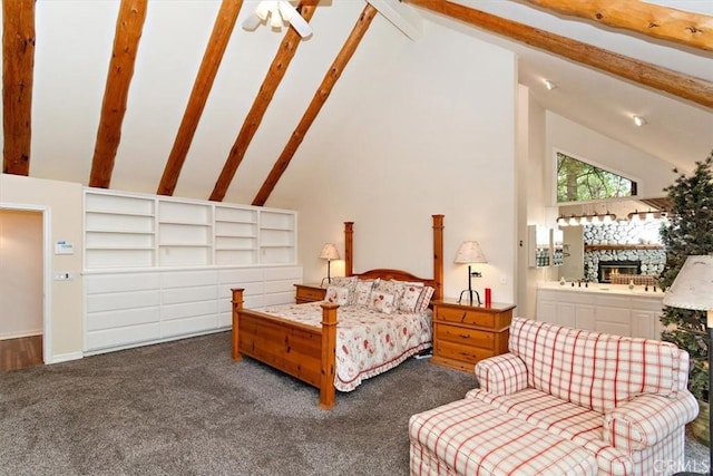 carpeted bedroom featuring beam ceiling and high vaulted ceiling