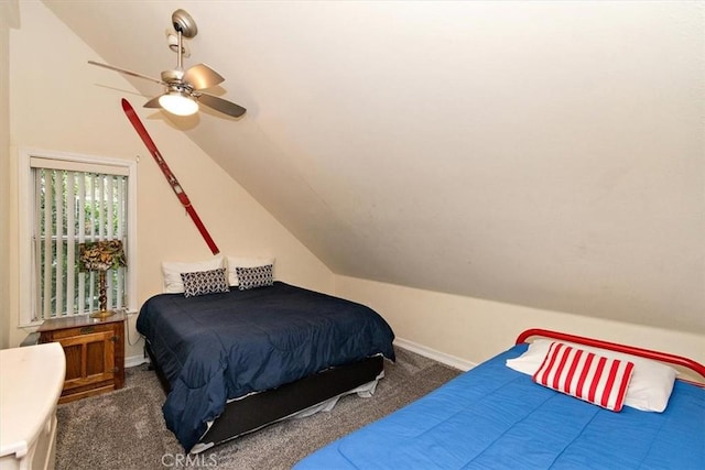 bedroom with vaulted ceiling, ceiling fan, and dark carpet