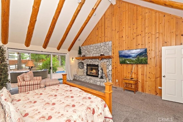 carpeted bedroom with access to exterior, high vaulted ceiling, a fireplace, beamed ceiling, and wood walls