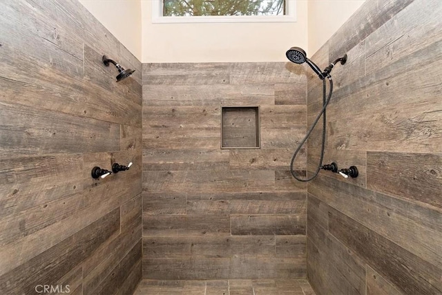 bathroom with a tile shower