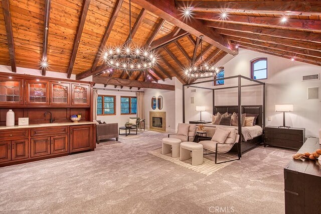 bedroom featuring light carpet, visible vents, wood ceiling, and a chandelier