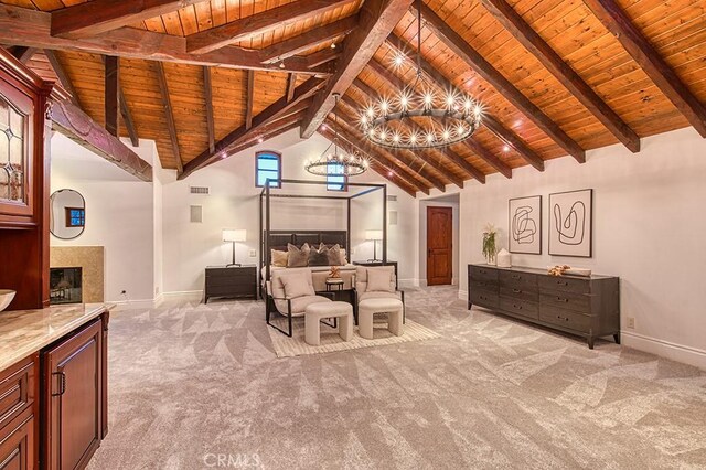 living area with light carpet, beam ceiling, wood ceiling, and baseboards