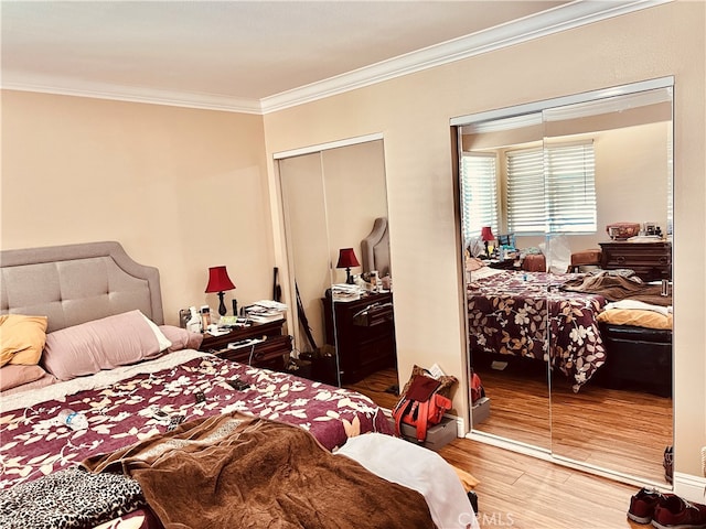 bedroom featuring hardwood / wood-style floors and ornamental molding