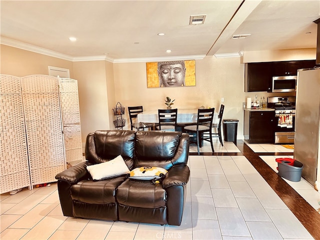 cinema room with light tile patterned floors and crown molding