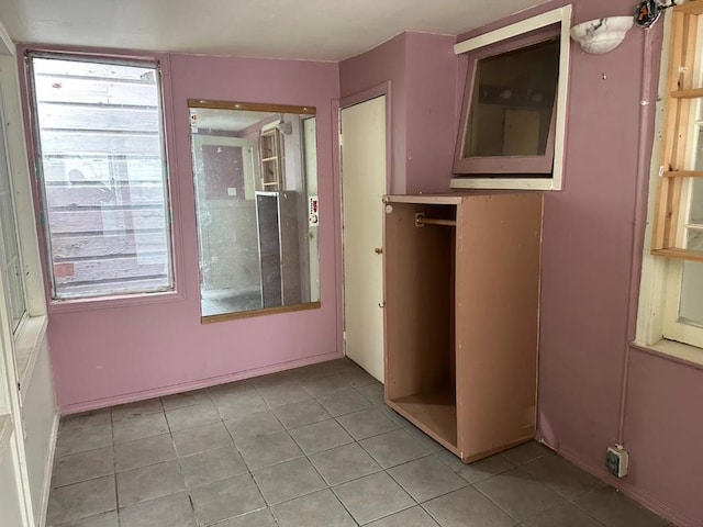 unfurnished bedroom featuring light tile patterned floors