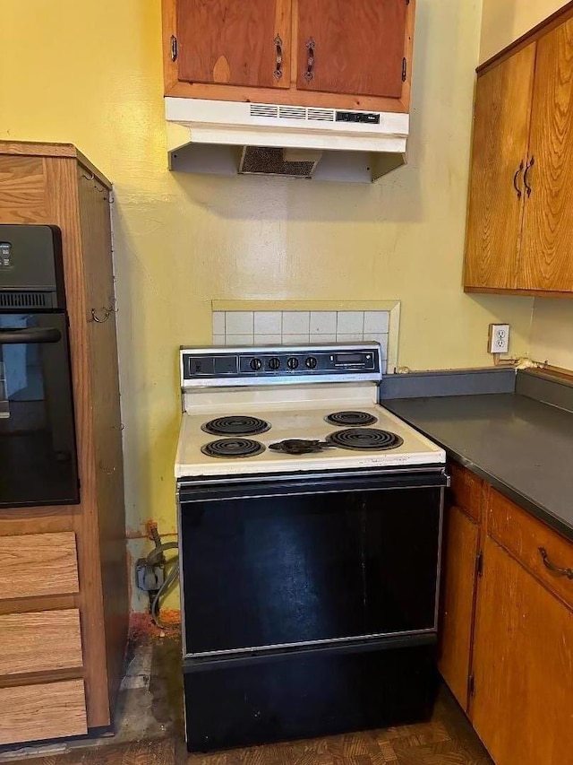 kitchen with black oven and range with electric cooktop