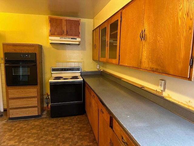 kitchen featuring dark parquet floors, black oven, and electric stove