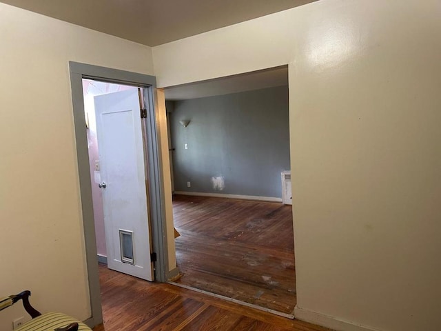 hall with dark hardwood / wood-style flooring