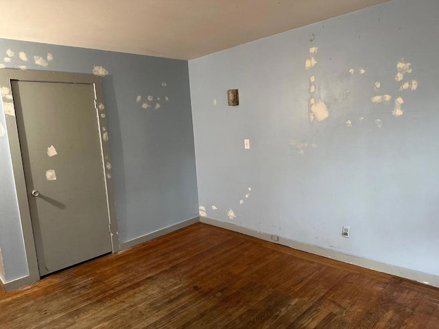 empty room featuring wood-type flooring