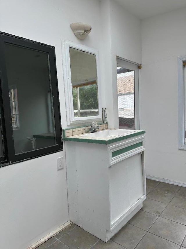 kitchen featuring white cabinets