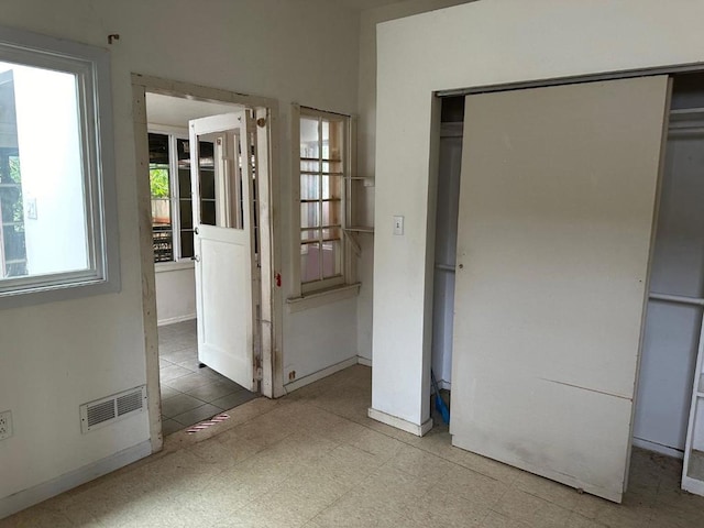 unfurnished bedroom featuring a closet