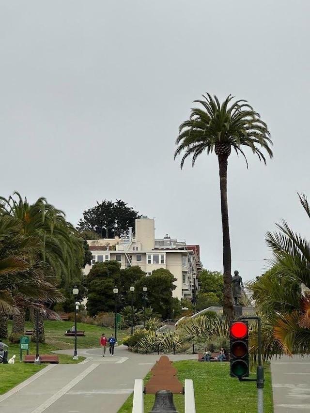 view of home's community featuring a lawn