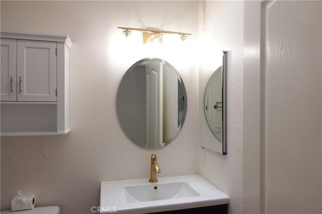 bathroom featuring toilet and sink