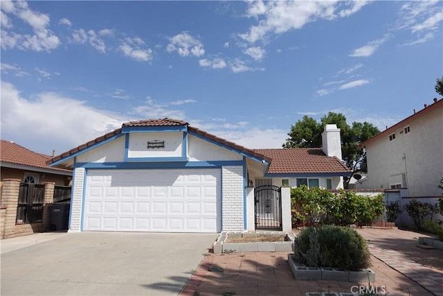 mediterranean / spanish-style house featuring a garage