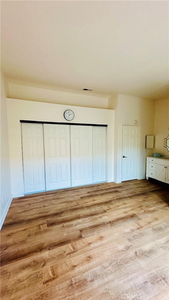 unfurnished bedroom with light hardwood / wood-style floors