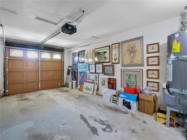 garage featuring a garage door opener and secured water heater