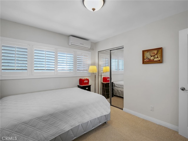 bedroom with a closet, light colored carpet, and a wall mounted AC