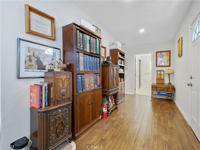 corridor featuring light hardwood / wood-style flooring