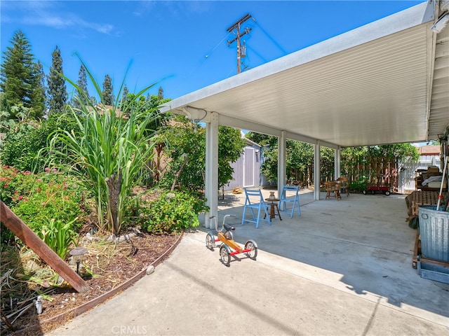 view of patio / terrace with a storage shed