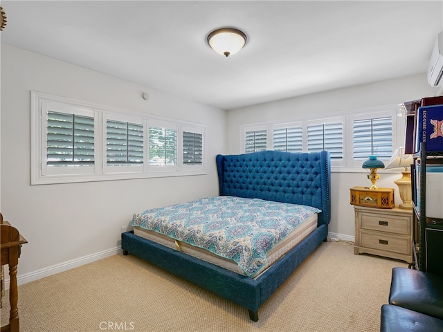 carpeted bedroom featuring an AC wall unit