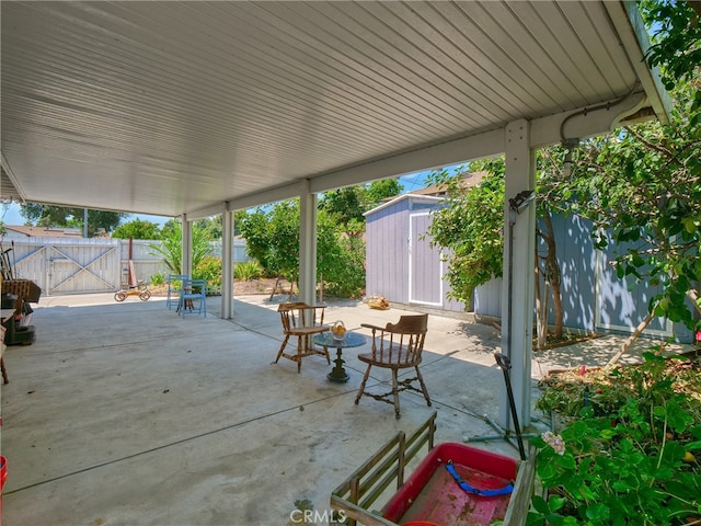 view of patio / terrace featuring a shed