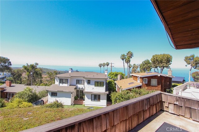 balcony featuring a water view