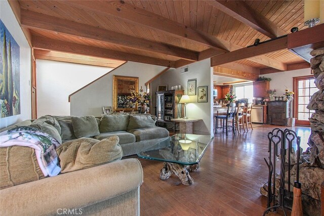 living room featuring vaulted ceiling with beams, wood ceiling, and dark hardwood / wood-style floors