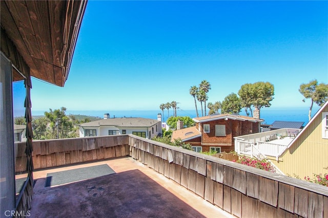 view of patio with a water view