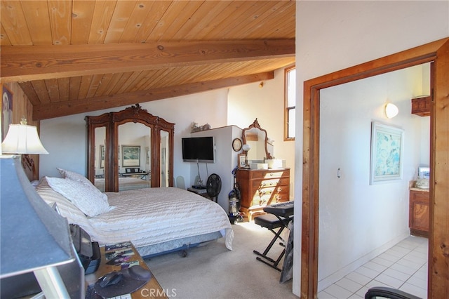 bedroom featuring lofted ceiling with beams, wooden ceiling, and light tile patterned floors