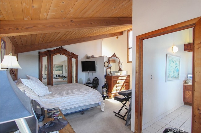 bedroom featuring beam ceiling, wooden ceiling, and tile patterned floors