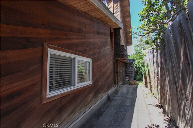 view of side of home with fence