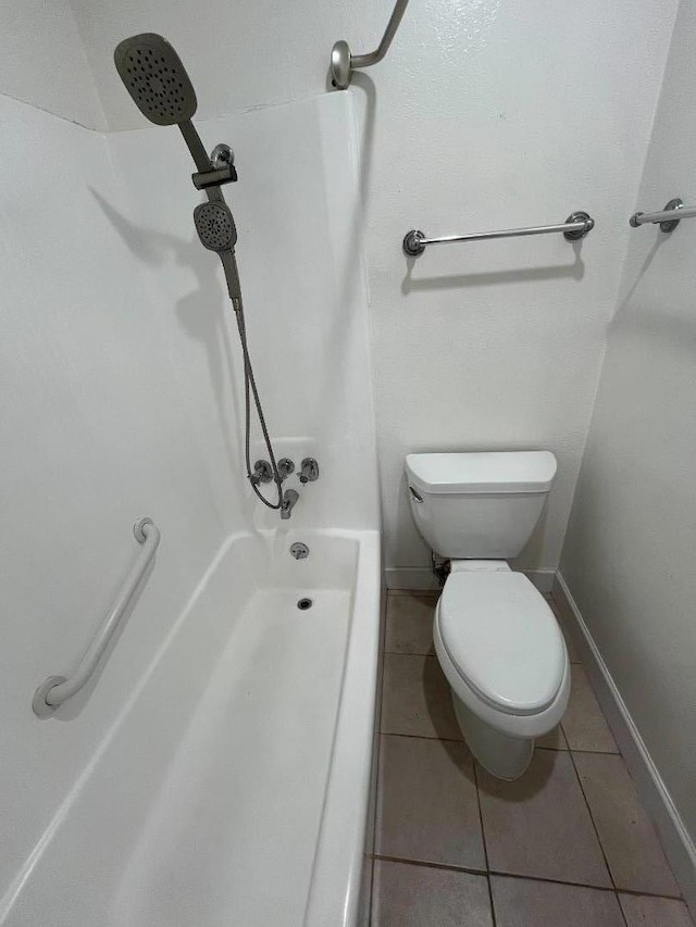 bathroom with tile patterned floors and toilet