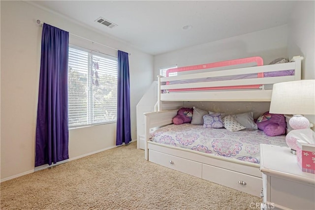 carpeted bedroom with baseboards and visible vents