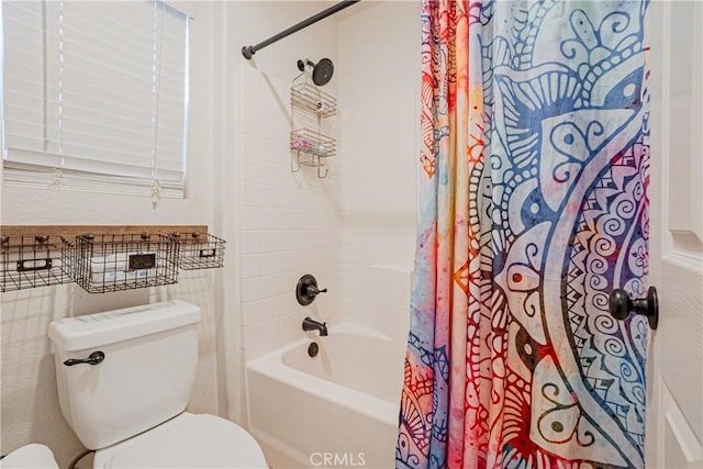 full bath featuring toilet and shower / tub combo with curtain