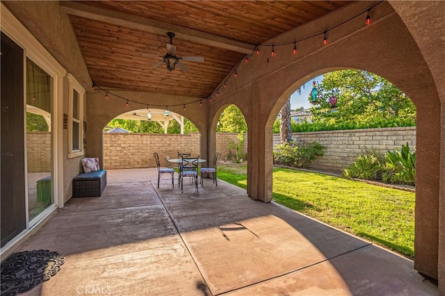 view of patio / terrace with outdoor dining area, a fenced backyard, and ceiling fan